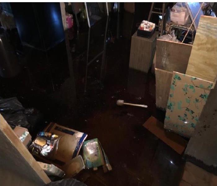 Home basement flooded due to frozen pipe. 